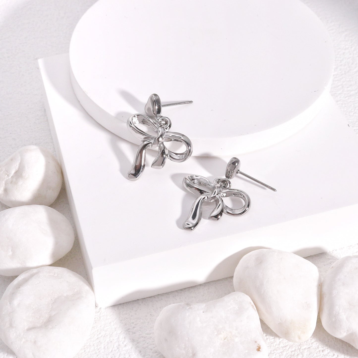 Colette Non-Tarnish Steel Bow Tie Ribbon Dangle Earrings