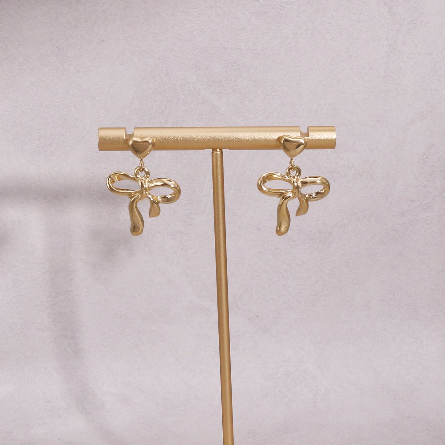 Colette Non-Tarnish Steel Bow Tie Ribbon Dangle Earrings