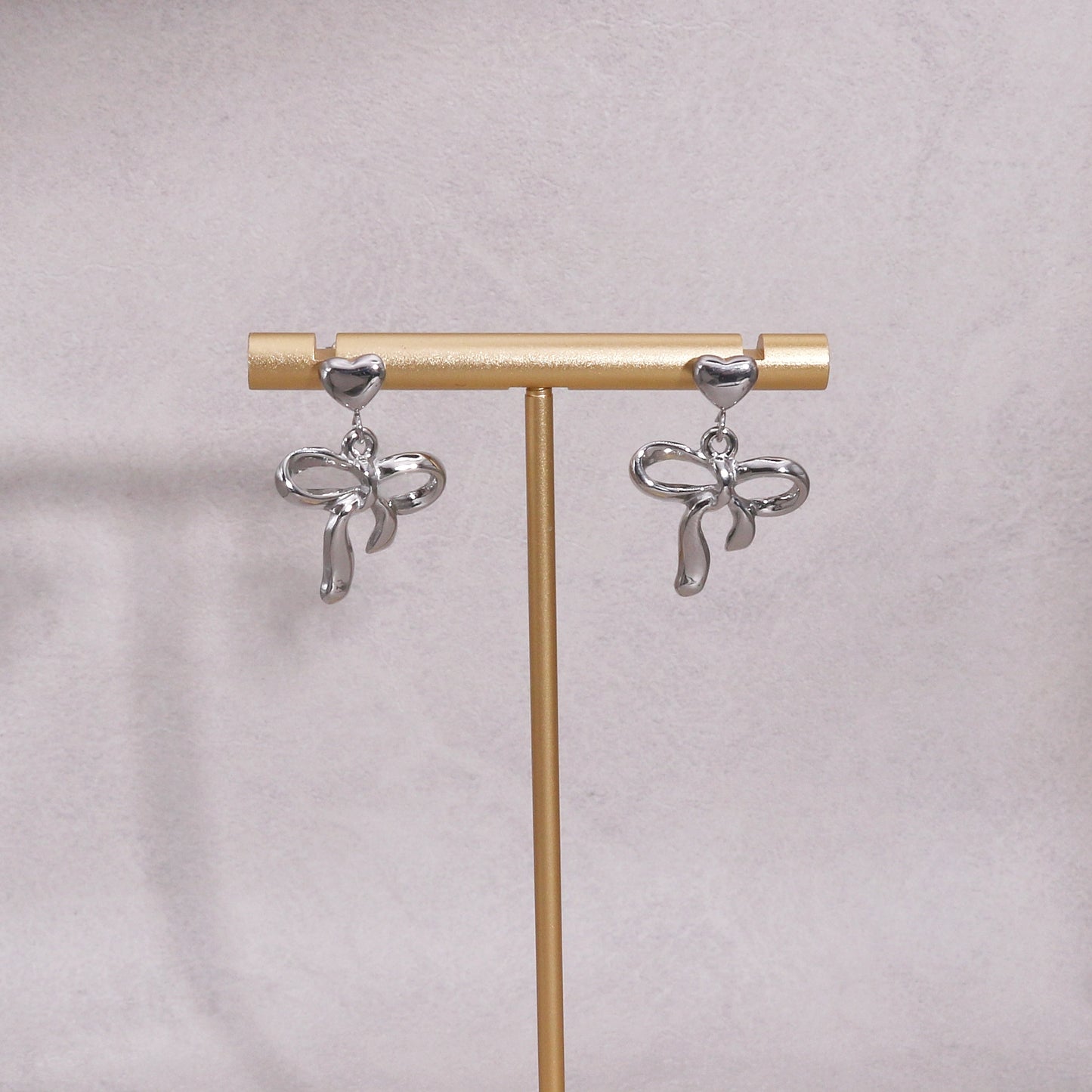 Colette Non-Tarnish Steel Bow Tie Ribbon Dangle Earrings