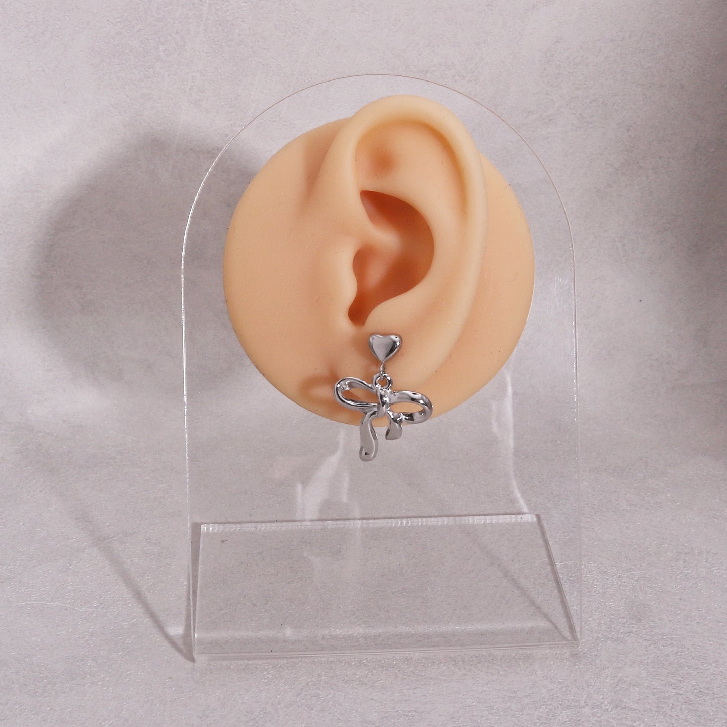 Colette Non-Tarnish Steel Bow Tie Ribbon Dangle Earrings