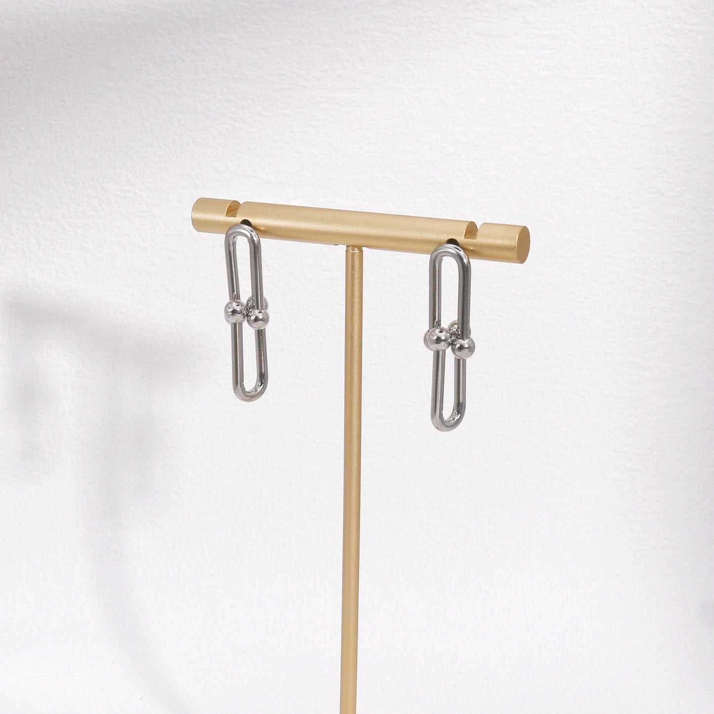 Ellanora Steel Hardware Statement Drop Earrings